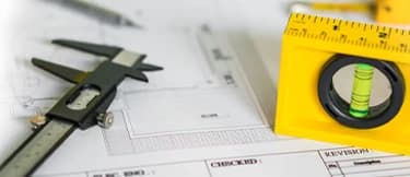 Precision tools and design documents representing EQAS processes